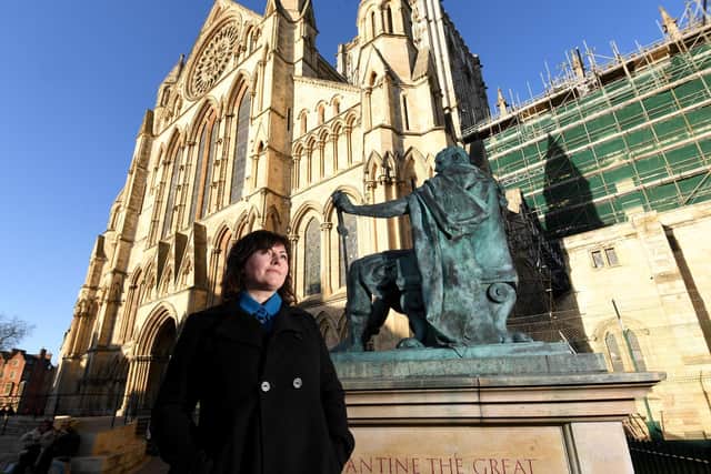 Dr Cobi Van Tonder, from the University of York, pictured outside York Minster, which is among the historic venues included in a project showcasing the acoustics of heritage sites around the globe. (Photo: Simon Hulme)