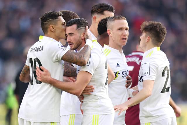 Jack Harrison celebrates with teammate Raphinha of Leeds United after scoring their team's first goal during the Premier League match between West Ham United and Leeds United at London Stadium on January 16, 2022 in London, England. (Picture: Alex Pantling/Getty Images)