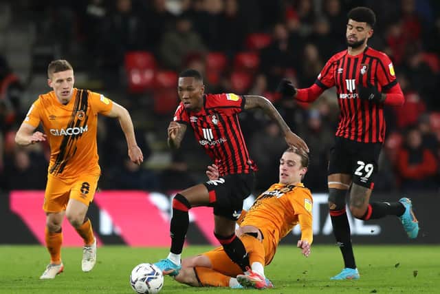 Hull City's Tom Eaves (centre right) challenges Bournemouth's Jaidon Anthony (centre left) (Picture: PA)