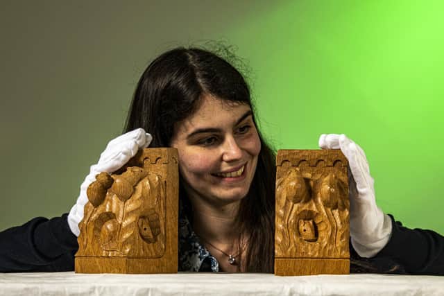 Jenny Hill, museum and collections lead with Mouseman bookends formerly owned by Kenneth Hodgson who bequeathed his Mouseman collection to the Craven Museum in Skipton where some items are on display.