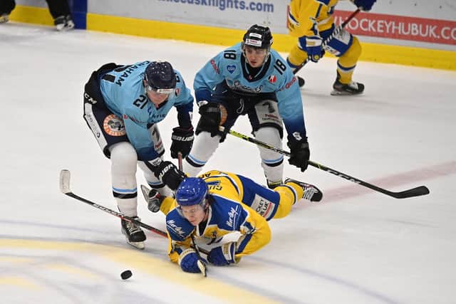 Leeds Knights' Harry Gulliver takes a tumble under pressure from Sheffield Steeldogs' Alex Graham and Louie Newell. Picture: Bruce Rollinson