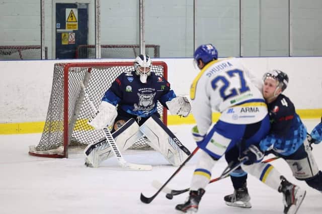 Cole Shudra (27) fires off a shot against Sheffield Steeldogs' netminder Dmitri Ziozdra. Picture: Peter Best Photography.