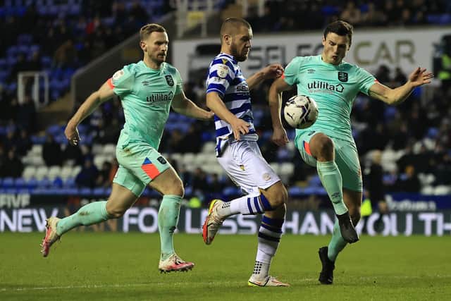 Reading's George Puscas and Huddersfield Town's Matt Pearson battle at the Madejski Stadium Picture: David Rogers/Getty Images
