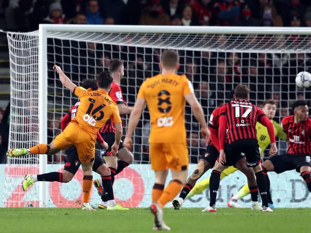TAKE THAT: Hull City's Ryan Longman (left) scores his side's winning goal at Bournemouth. Picture: Kieran Cleeves/PA