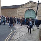 Extras gathered outside one of The Piece Hall gates