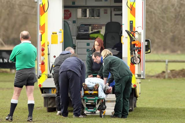 Alex Bennett is transferred to an ambulance at Sandal RUFC.