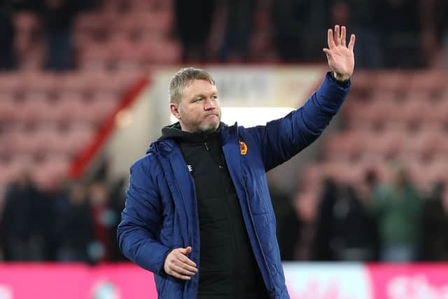 Hull City manager Grant McCann salutes the fans after the final whistle following a 1-0 win at Bournemouth on Saturday - likely to be his lat game in charge. Picture: Kieran Cleeves/PA