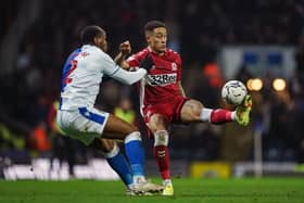 Blackburn Rovers' Ryan Nyambe and Middlesbrough's Marcus Tavernier (right) battle for the ball at Ewood Park Picture: Mike Egerton/PA