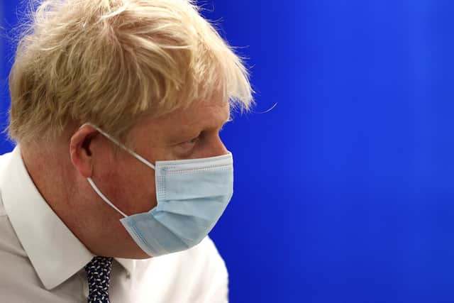 Boris Johnson during a visit to Milton Keynes University hospital on Momday before the latest revelations about Downing Street parties emerged.