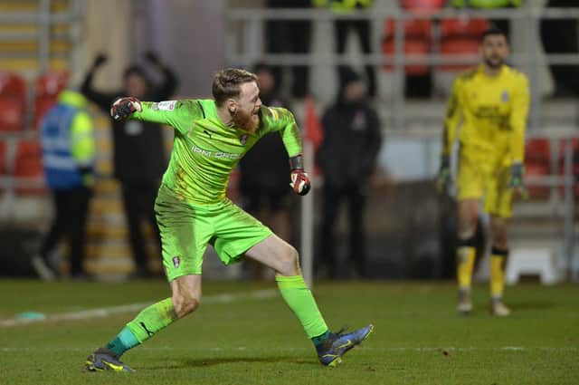 Viktor Johansson celebrates after saving Adam May's penalty to help Rotherham United move to within a game of Wembley with a penalty shoot-out win over Cambridge United in the EFL Trophy. Picture: Bruce Rollinson