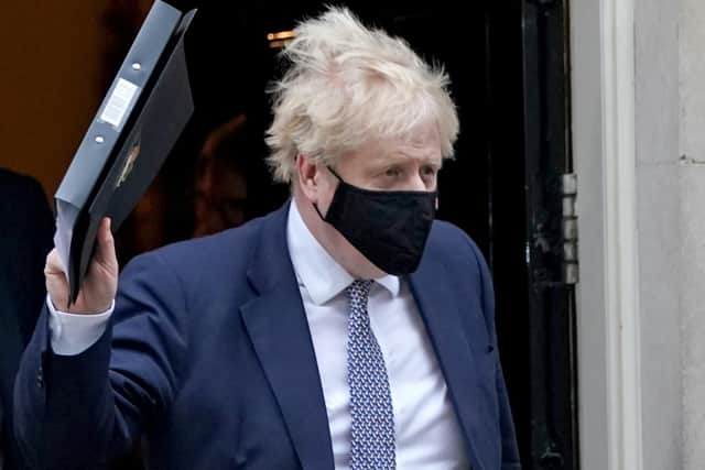 Prime Minister Boris Johnson leaves 10 Downing Street to make a statement in the House of Commons, Westminster, after it was announced that Scotland Yard has launched an investigation into a "number of events" in Downing Street and Whitehall in relation to potential beaches of coronavirus laws (PA)