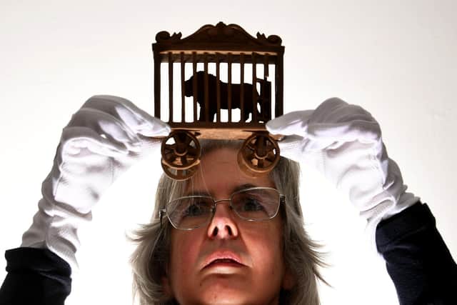 Curious Creatures Exhibition at the Abbey House Museum, Leeds: Curator Kitty Ross is pictured with a Model Lion in a Cage made by Fred Day of Armley, Leeds late 18th century  Picture: Simon Hulme