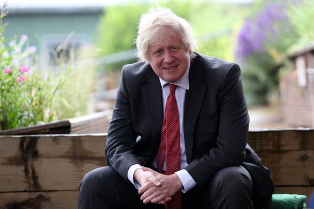 Boris Johnson during a socially distanced visit to Bovingdon Primary School on the day that Downing Street held a lockdown gathering to mark his 56th birthday.