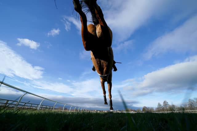A runner and rider jump a fence during the Try Racing TV For Free Now Conditional Jockeys' Veterans' Handicap Chase at Catterick Bridge Racecourse. Pictures: Mike Egerton/PA Wire. .