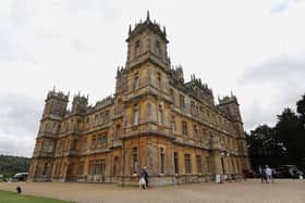 Visitors attend a 1920's themed event at Highclere Castle on September 7, 2019, ahead of the world premiere of the Downton Abbey film [Photo: ISABEL INFANTES/AFP via Getty Images]