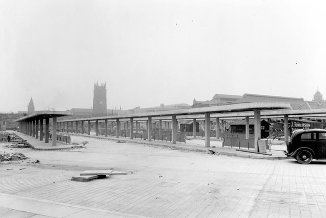 A view of the bus stands as the construction work near completion in July 1938. Leeds Parish Church can be seen, on the right, part of the roof of Kirkgate Market building