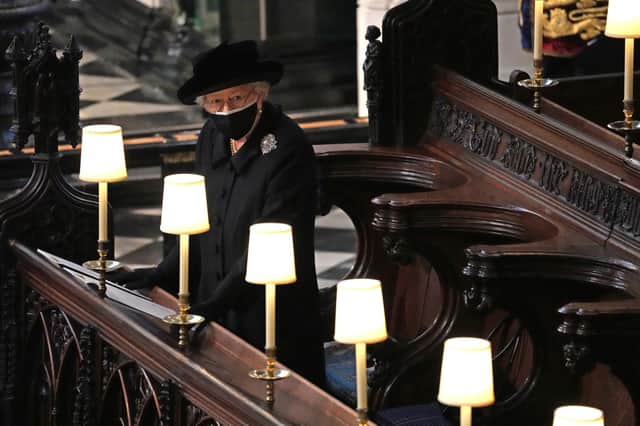 The Queen mourned alone at Prince Philip's funeral because she did not want to be made a special case during the Covid lockdown.