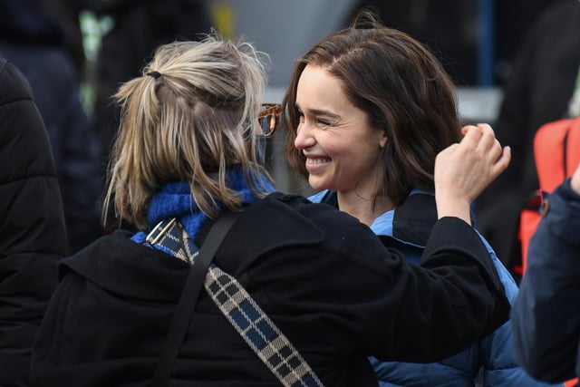 Emilia Clarke having her hair and make-up checked as she films outside The Piece Hall today. Photo by Getty Images.