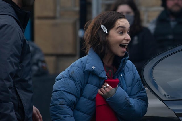 Emilia Clarke laughing between takes outside The Piece Hall this afternoon. Photo by Chloe McBride.