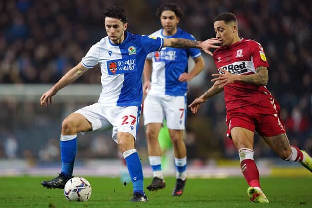 Blackburn Rovers' Lewis Travis and Middlesbrough's Marcus Tavernier (right) battle for the ball at Ewood Park. Picture: Mike Egerton/PA