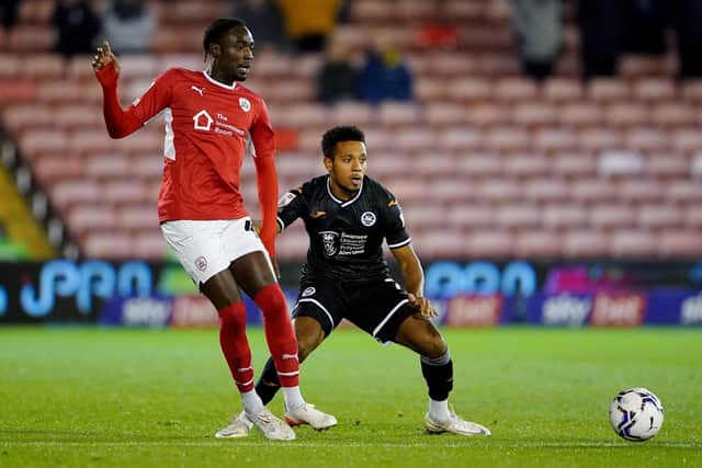Barnsley's Devante Cole in action against Swansea City's Korey Smith in November. Picture: Zac Goodwin/PA