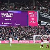 The big screen shows the VAR decision to disallow a Leeds United goal for an offisde at West Ham United on January 16 Picture: Mike Hewitt/Getty Images