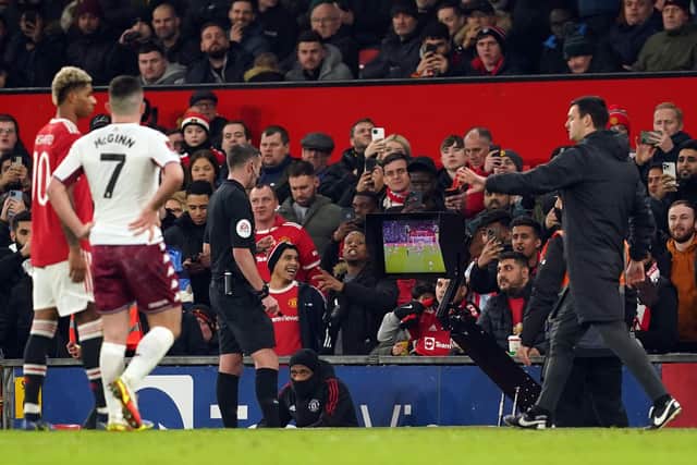 Referee Michael Oliver consults VAR to decide on Aston Villa's Danny Ings' goal during the FA Cup third round match against Manchester United at Old Trafford on  January 10. Picture: Martin Rickett/PA