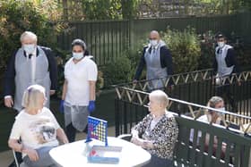 Prime Minister Boris Johnson (second left), Health Secretary Sajid Javid and Chancellor of the Exchequer Rishi Sunak (right) talk to residents Doreen (left) and Janet during a visit to Westport Care Home in Stepney Green, east London, ahead of unveiling his long-awaited plan to fix the broken social care system last September.