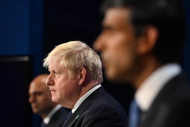 (Left to right) Health Secretary Sajid Javid, Prime Minister Boris Johnson and Chancellor of the Exchequer Rishi Sunak, during a media briefing in Downing Street, London, on the long-awaited plan to fix the broken social care system. last September.