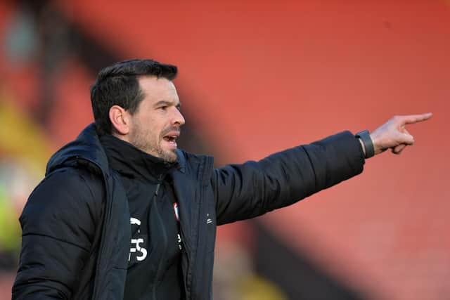 Assistant coach Ferran Sibila points the way for Barnsley's players against Bournemouth. Picture: Bruce Rollinson.
