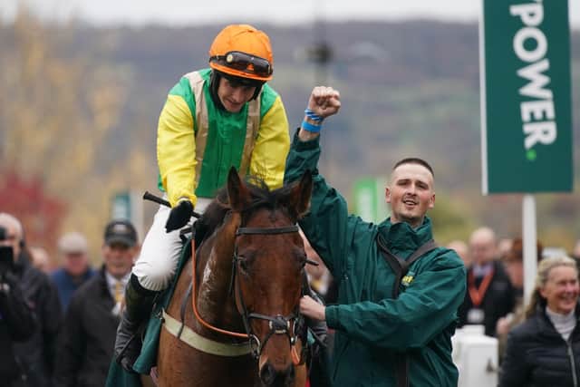 Happier times last November - Midnight Shadow ridden by jockey Ryan Mania after winning the Paddy Power Gold Cup as stable lad Reece Jarosiewicz celebrates the win.