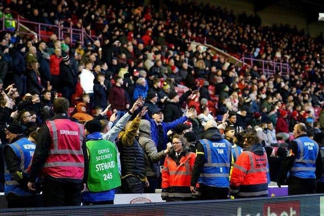 Barnsley fans clash with stewards after protesting against the owners of the club during the Sky Bet Championship match at Oakwell Stadium, Barnsley.