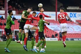 Up against it: Barnsley’s Michal Helik rises for a high ball in the crowded Bournemouth penalty area (Picture: Bruce Rollinson)
