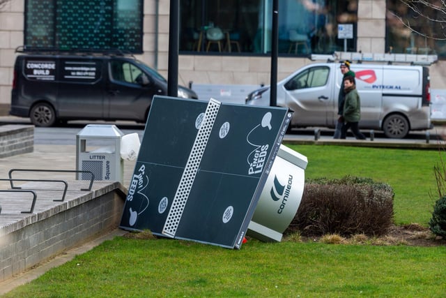 A table tennis table in Sovereign Square, Leeds, has been blown onto its side by the strong winds.