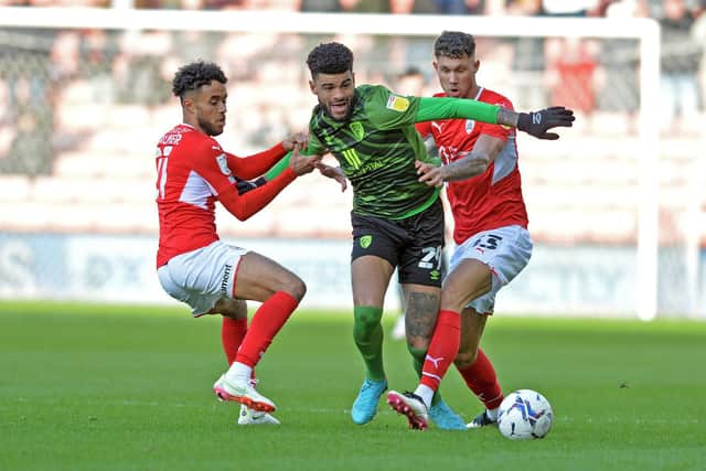 Bournemouth's Philip Billing gets between Barnsley opponents Romal Palmer and Matty Wolfe. Picture: Bruce Rollinson.