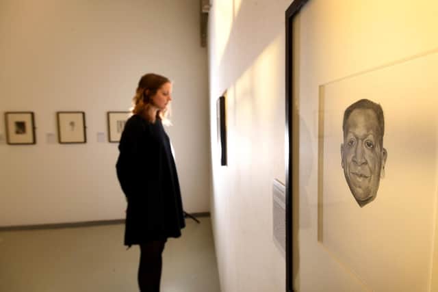 Exhibition of work by artist Georgia 0''Keefe at the Point Doncaster...Amy Knowles is pictured looking at the drawings on display
Picture Simon Hulme