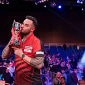 Joe Cullen kisses the Masters trophy following his win over Dave Chisnall. Picture by Taka Wu/PDC.
