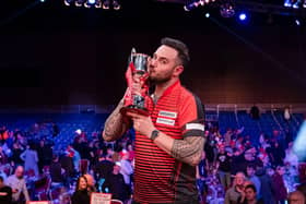 Joe Cullen kisses the Masters trophy following his win over Dave Chisnall. Picture by Taka Wu/PDC.