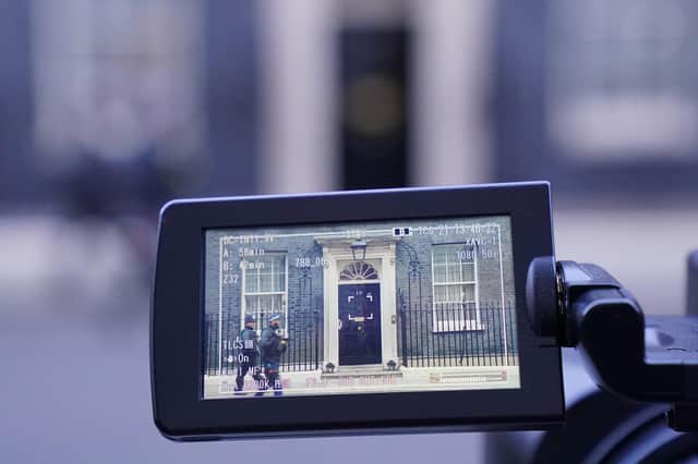 A view in the screen of a video camera of the front door of 10 Downing Street, London.
