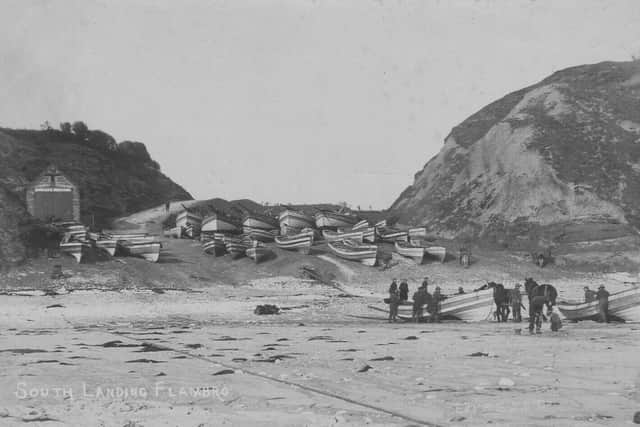 South Landing Lifeboat Station 2, circa 1900, showing cobles pulled up on the beach