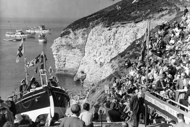 8th September 1953: Holidaymakers on the cliffs and in pleasure boats anchored close inshore watched the naming ceremony of the new Flamborough lifeboat.
Archive pic: YPN
