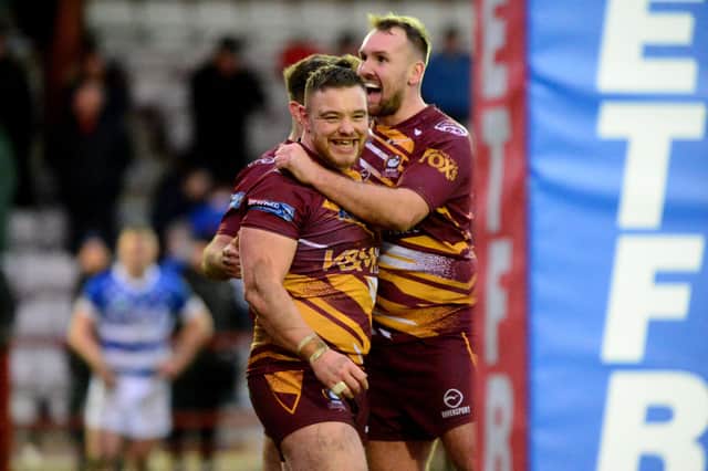 Winning start: Batley Bulldogs' players Tom Lillycrop, left, and Adam Gledhill celebrate their win over Halifax Panthers. Picture: James Hardisty