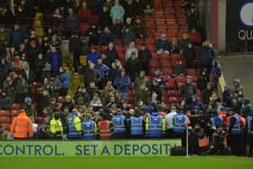 Fans protest during Barnsley's match with Bournemouth.   Picture: Bruce Rollinson