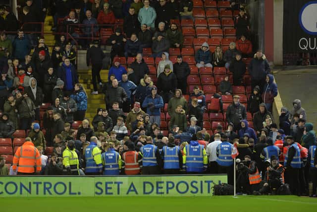 Fans protest during Barnsley's match with Bournemouth.   Picture: Bruce Rollinson