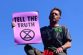 Chris Packham in 2019 making a speech on top of a bus stop during the Extinction Rebellion demonstration on Waterloo Bridge in London. Picture: Victoria Jones/PA Archive/PA Images.