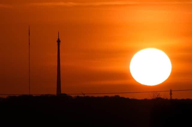 Looking towards Emley TV masts from Ryhill at sunset, by Sue Billcliffe