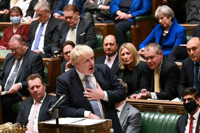 Boris Johnson and his predecessor Theresa May clashed in Parliament over the 'partygate' report.
