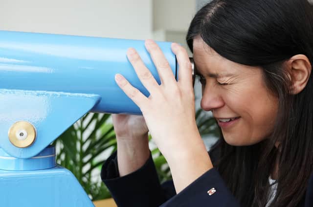 Lisa Nandy, Shadow Secretary of State for Levelling Up, Housing, Communities & Local Government looks through a telescope to see a wind farm at the Orsted Visitor Centre at East Coast Hub on January 27, 2022 in Grimsby, United Kingdom. Nandy visited major local employers to hear how investment in green technology is providing jobs and apprenticeships for local people and met with business and community leaders working to secure Grimsby's future.