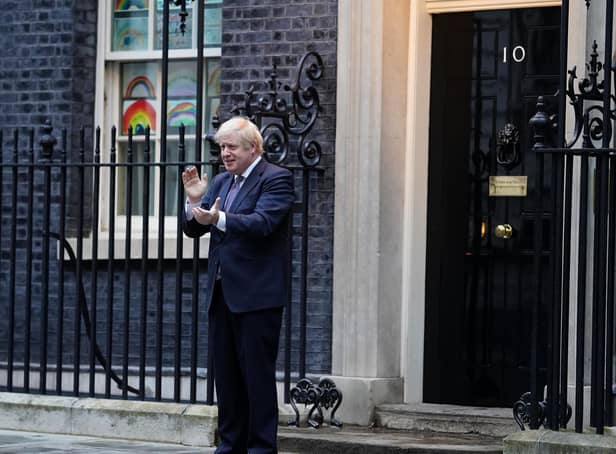 Library image of Prime Minister Boris Johnson outside 10 Downing Street as he joins in the nationwide Clap for Carers. Millions of people made sacrifices to support the Government's bid to halt the pandemic.