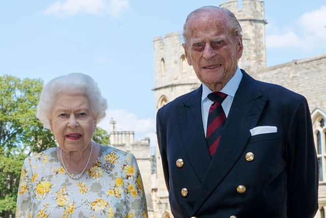 File photo dated 1/6/2020 of Queen Elizabeth II and the Duke of Edinburgh pictured in the quadrangle of Windsor Castle ahead of his 99th birthday.